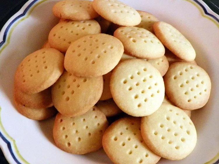A white plate full of scottish shortbread biscuits